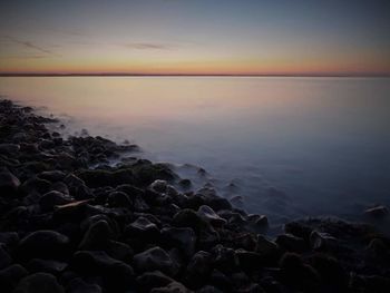 Scenic view of sea against clear sky during sunset