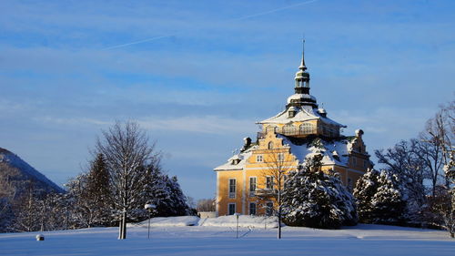 Traditional building against sky during winter