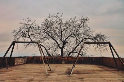 Low angle view of swing against sky