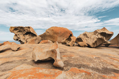 Rock formations on landscape against sky