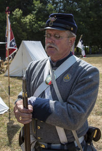 Portrait of man holding umbrella