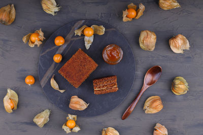 Honey cake. classic honey cake. on a dark slate or concrete background. cut and slice of cake.