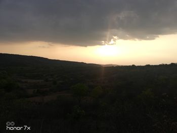 Scenic view of landscape against sky during sunset