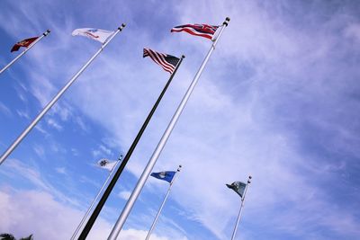 Low angle view of crane against blue sky