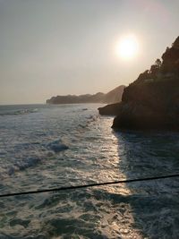 Scenic view of sea against clear sky during sunset