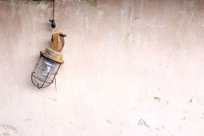 High angle view of old equipment hanging on wall