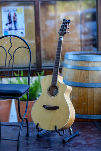 Guitar by empty chair