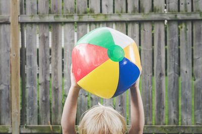 Boy balloons in balloon