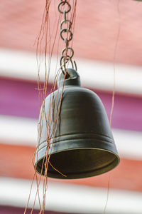 Close-up of chain hanging on wall