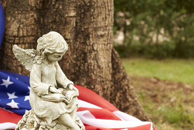 High angle view of statue by american flag at park