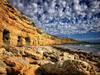 Scenic view of sea against cloudy sky