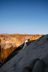 Scenic view of landscape against clear blue sky