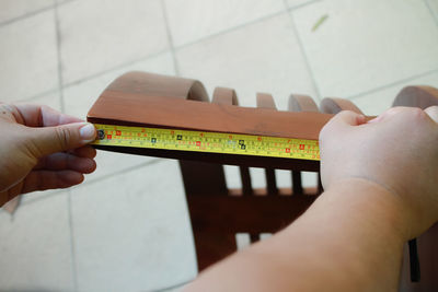 Close-up of hand holding paper