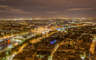 High angle view of illuminated city buildings at night