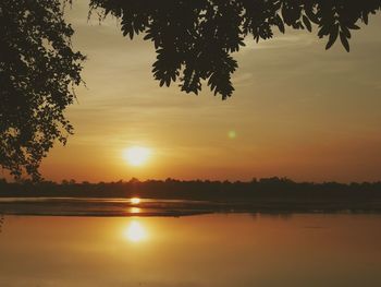 Scenic view of lake against sky during sunset