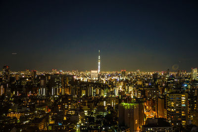 Illuminated buildings in city at night