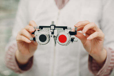 Close-up of man holding camera