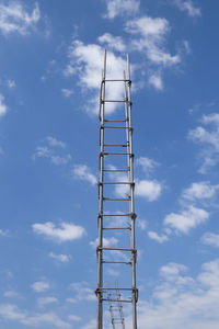 Low angle view of communications tower against sky