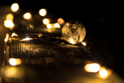 Low angle view of illuminated light bulb