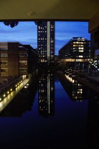 Reflection of illuminated buildings in water