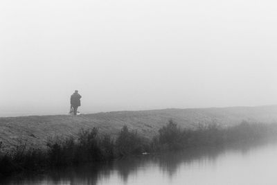 Silhouette of man against sky