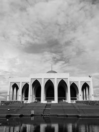 Exterior of historical building against cloudy sky