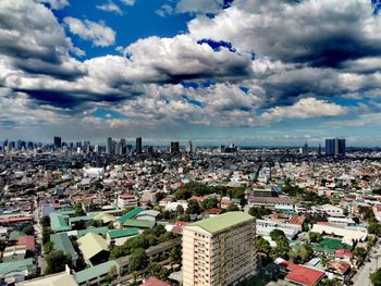 High angle view of buildings in city against sky