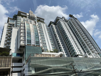 Low angle view of modern buildings against sky in city