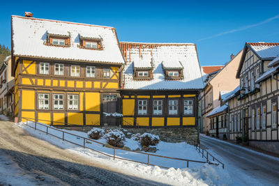 Residential building against sky during winter