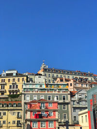 Low angle view of buildings against blue sky