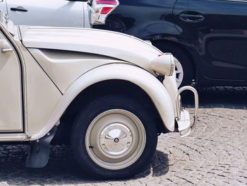 Vintage car parked on street in city