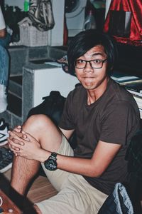 Portrait of smiling young man sitting