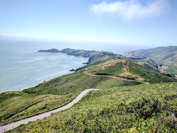 High angle view of road by sea against sky