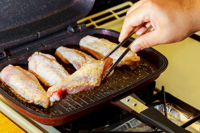 Close-up of man preparing food