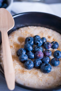High angle view of blueberries on porridge