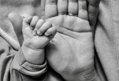 Low section of baby feet