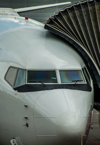 Close-up of airplane on airport runway