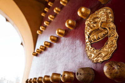 Close-up of antique fan in temple