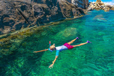 Full length of woman snorkeling in sea