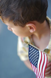 High angle view of toddler boy with american flag