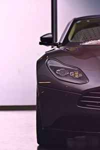 Close-up of vintage car on table against wall