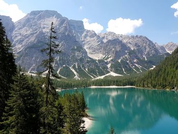 Scenic view of lake and mountains against sky