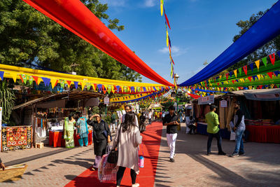 Group of people walking in market