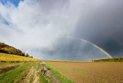 View of rainbow against cloudy sky