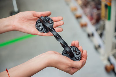 Cropped hand of woman holding key