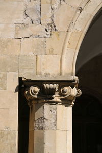 Low angle view of sculpture against building