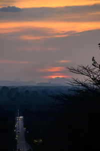 Scenic view of sunset over city