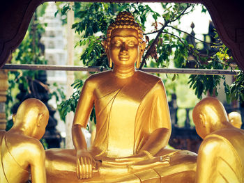 Statue against temple outside building