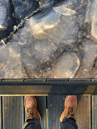 Low section of man standing outdoors