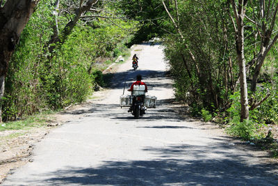 Man carrying things on a motorcycle